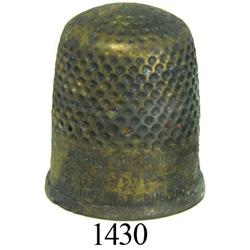 Medium brass sailmaker's thimble, uncleaned.