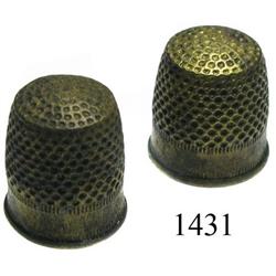 Lot of 2 small brass sailmaker's thimbles.