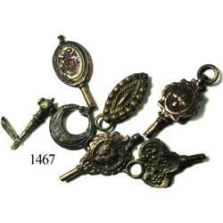 Lot of 6 cuprous watch keys and fobs.