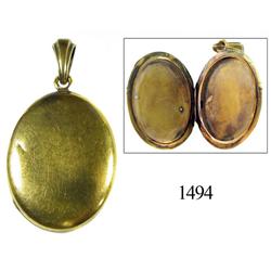 Gold oval locket.