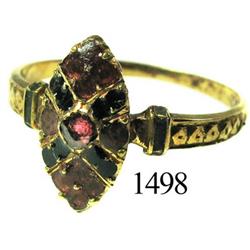 Low-grade gold ring with red stone and enamel.