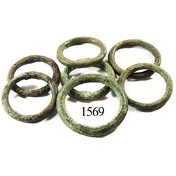 Lot of 7 bronze equestrian bridle rings.