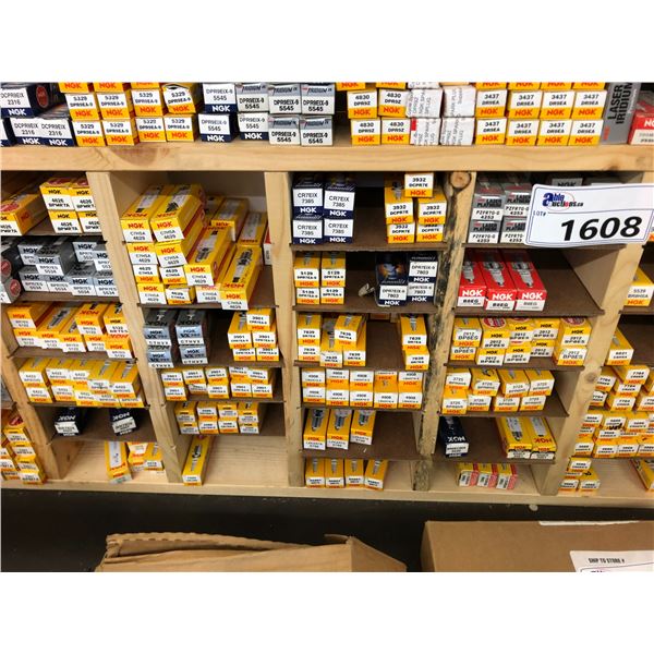 4 SECTIONS OF ASSORTED SPARK PLUGS