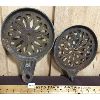 Image 2 : LOT OF 3 - ORNATE CAST IRON TRIVETS AND LARGE FUNNEL
