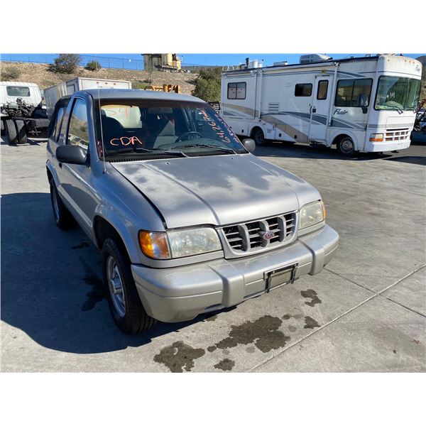 1999	Kia	Sportage