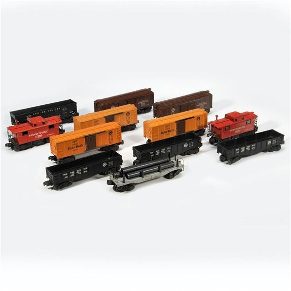 Lionel 12 Postwar Freight Cars with Coil Couplers.