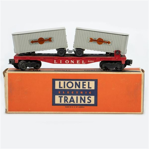 Lionel Postwar 6430 Flat Car with Cooper Jarrett trailers in original box.
