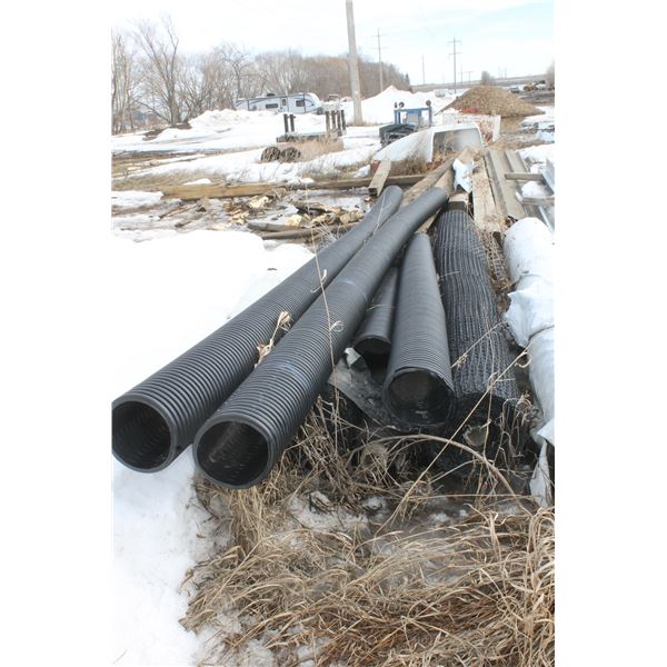 Rolls of Black Mesh and Black Pipe