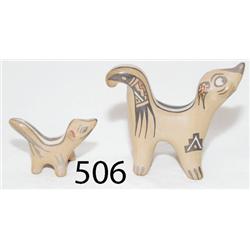 TWO SANTA CLARA POTTERY SKUNKS
