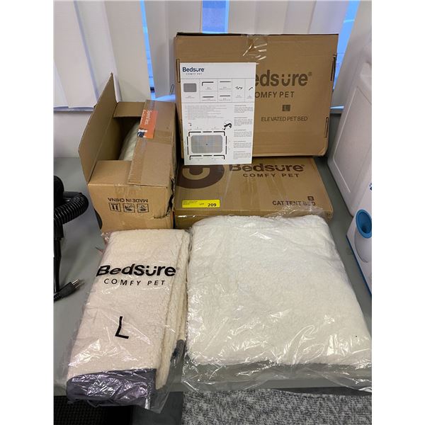 Two Bedsure Elevated Pet Beds with bed cowering and pillow