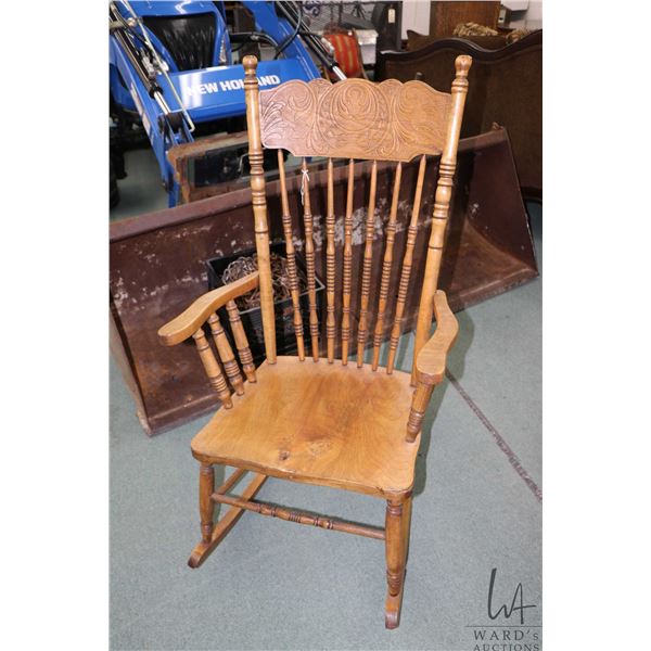 Antique Canadian pressed back rocking chair with replaced seat