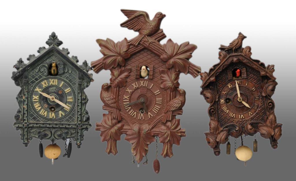 Lot of 3 Miniature Figural Novelty Clocks.