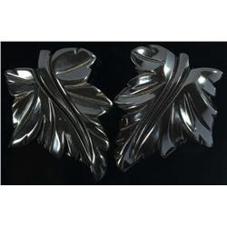 Pair of Bakelite Deeply Carved Black Floral Clips.