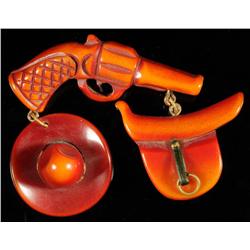 Bakelite Over Dyed Gun, Hat & Saddle Pin.