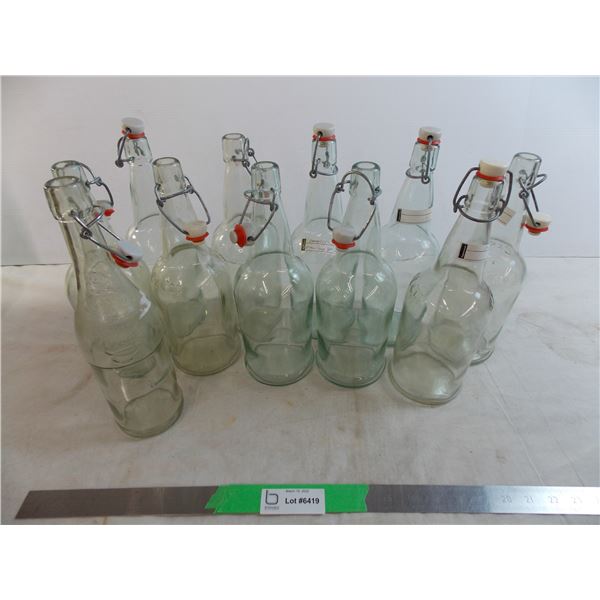 (11) swing top clear bottles