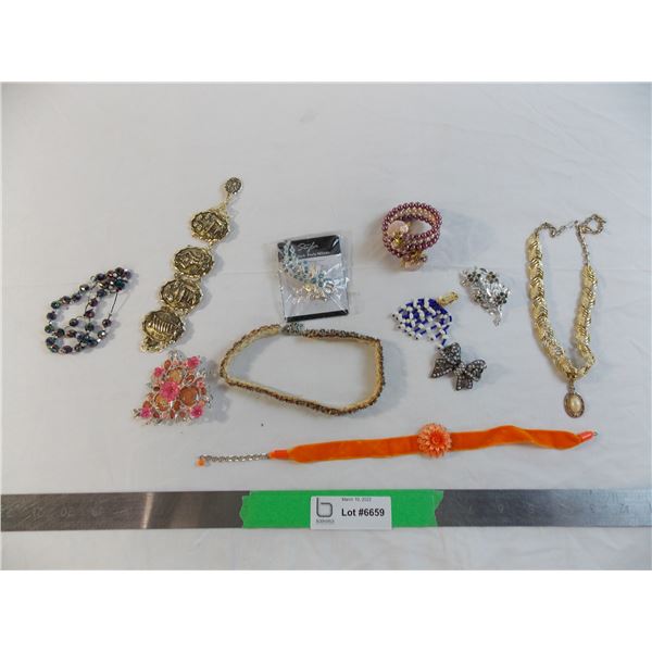 Variety of jewelry, bracelets, brooches, etc