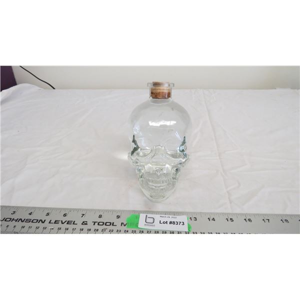 Glass skull bottle with water inside