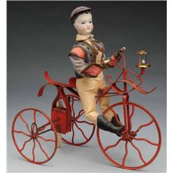 Mechanical Clockwork Boy Riding Bicycle.