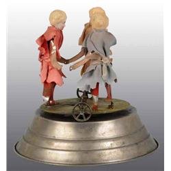 Wind-Up Toy with 3 Bisque Head Children.