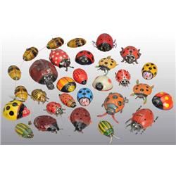 Lot of 25: Tin Beetle Toys.