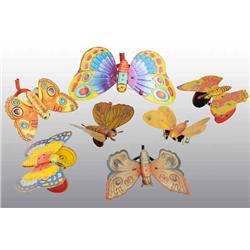 Lot of 7: Tin Litho Butterfly Toys.