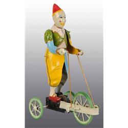 Tin Hand-Painted Clown Wind-Up Toy.
