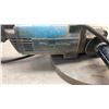 Image 2 : MAKITA HEAVY DUTY 9" ANGLE GRINDER WORKING
