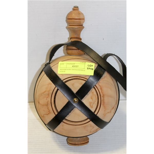 WOODEN DECANTER WITH LEATHER STRAP.