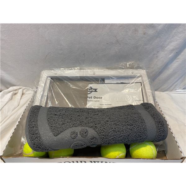 Pet door, mat and tennis balls