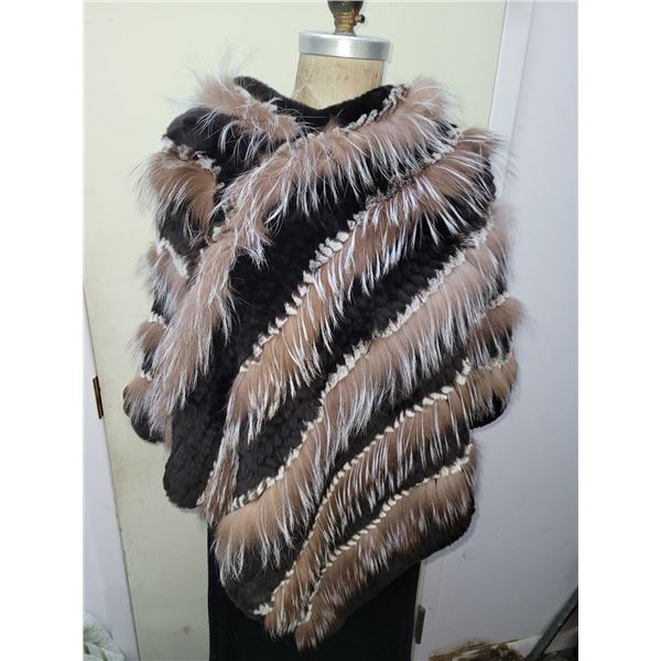Courtesy of Muscalus Furs a Beautiful Crystal Fox with Brown Rex inserts Poncho