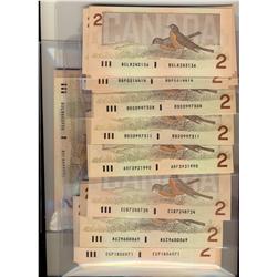 1986 $2. Lot of 229 notes including different prefixes and d