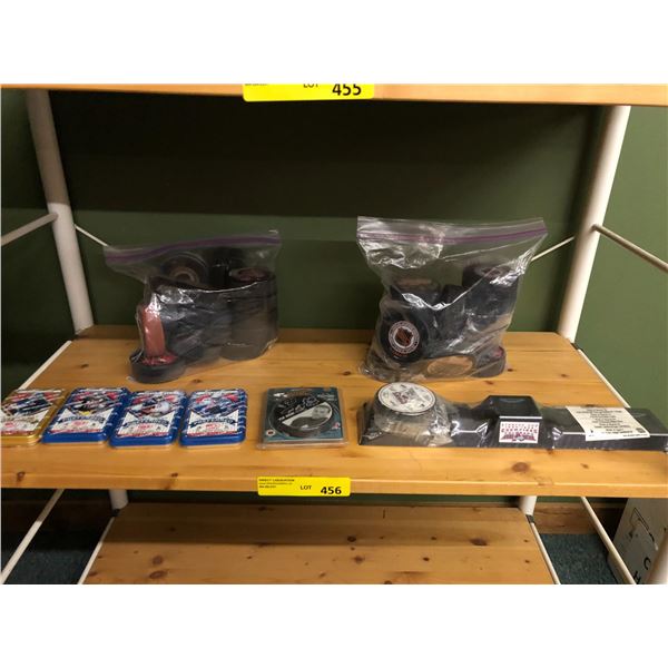 Shelf Lot of Hockey Pucks and  Sealed Collector Tins