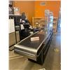 Image 2 : Pan Osten Check out counter stainless top with conveyor system and storage. bumper rails and plexi g