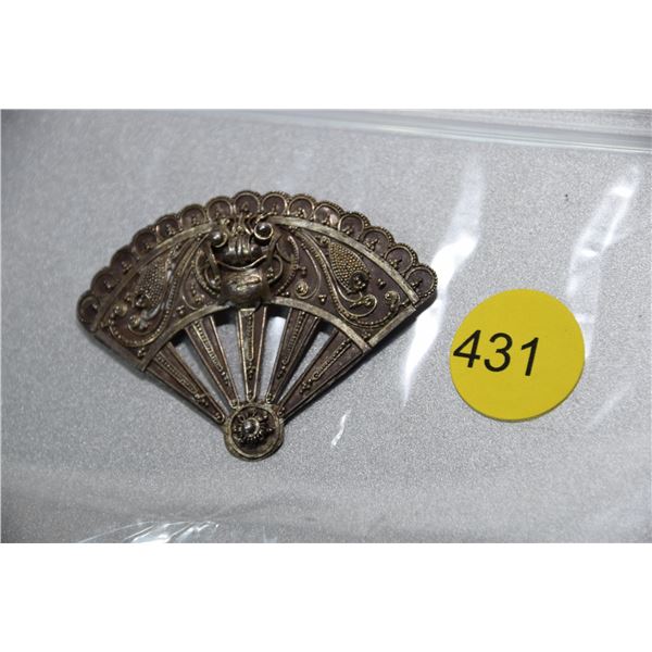 Ornate brooch