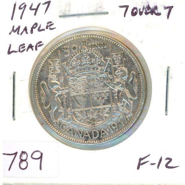 1947 Maple Leaf Silver 50 Cents. Key Date. Mintage of 38,433. Interesting 7/7 variety. F-12. Scarce.