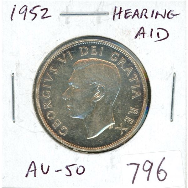 1952 Silver 50 Cents. Hearing Aid variety, the result of a Die Clash. AU-50.