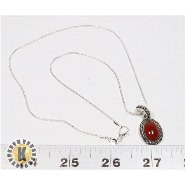 26)  TIBETAN SILVER AND RED CARNELIAN OVAL