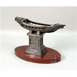 A SILVER METAL BOAT GARNITURE