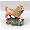 Image 1 : A STAFFORDSHIRE PORCELAIN LION FIGURE