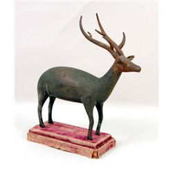 A CAST-METAL FIGURE OF A REINDEER