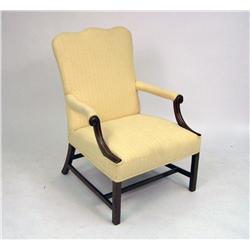 A GEORGE III CARVED LIBRARY CHAIR