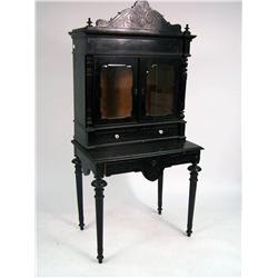 A VICTORIAN-ERA CARVED AND BLACK-PAINTED DESK AND BOOKCASE, ITALIAN
