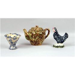 AN ENGLISH EARTHENWARE GLAZED TEAPOT
