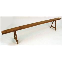 A BAROQUE-STYLE TURNED CHERRYWOOD LONG BENCH