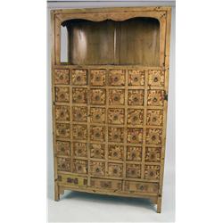 A CHINESE YELLOW AND BLACK LACQUER APOTHECARY CABINET