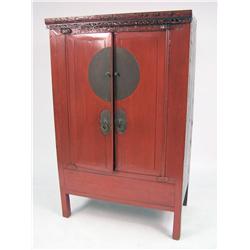 A CHINESE RED AND BLACK LACQUER CARVED HARDWOOD WEDDING CABINET