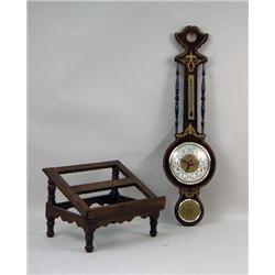 A CARVED WALNUT BOOK REST