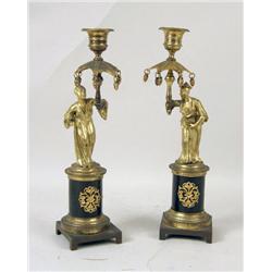 A PAIR OF GILT-METAL MOUNTED ORIENTAL FIGURES ON PORPHYRY BASES
