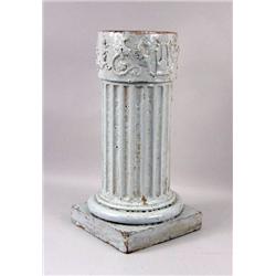 A WHITE GLAZED TERRACOTTA COLUMNAR-FORM GRYPHON MOTIF PEDESTAL