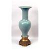 Image 1 : A LARGE CHINESE CELADON VASE ON A GILT-METAL BASE